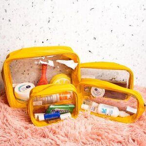 TRAVEL TIME Golden Yellow and Clear 4 Piece Travel & Cosmetic Pouch Set NWT
